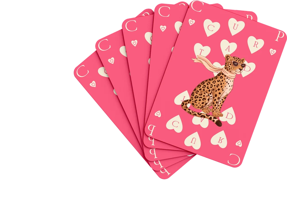 A fan of playing cards with a leopard and hearts